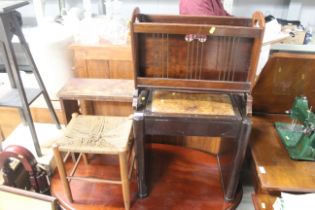 A piano stool, a magazine rack, a string seated st