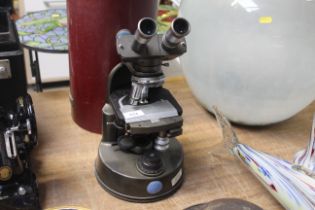 A C. Baker of London microscope with case