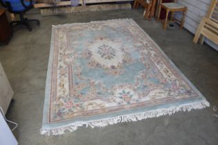 An approx. 9'8" x 6'3" floral patterned rug