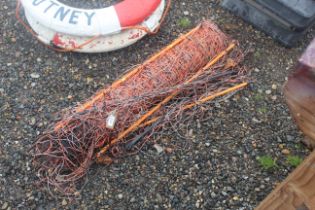 A quantity of electric fencing wire and posts