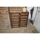 A haberdashery cabinet fitted twelve partly glazed fronted drawers AF