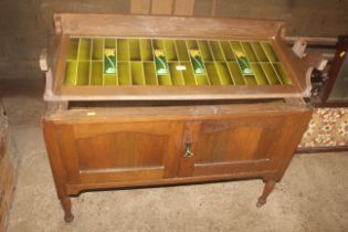 An Edwardian tiled back washstand (lacking marble