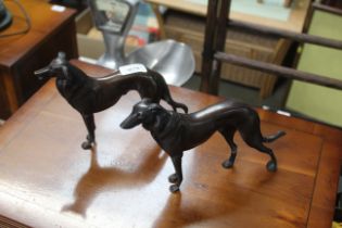 Two bronzed ornaments in the form of dogs