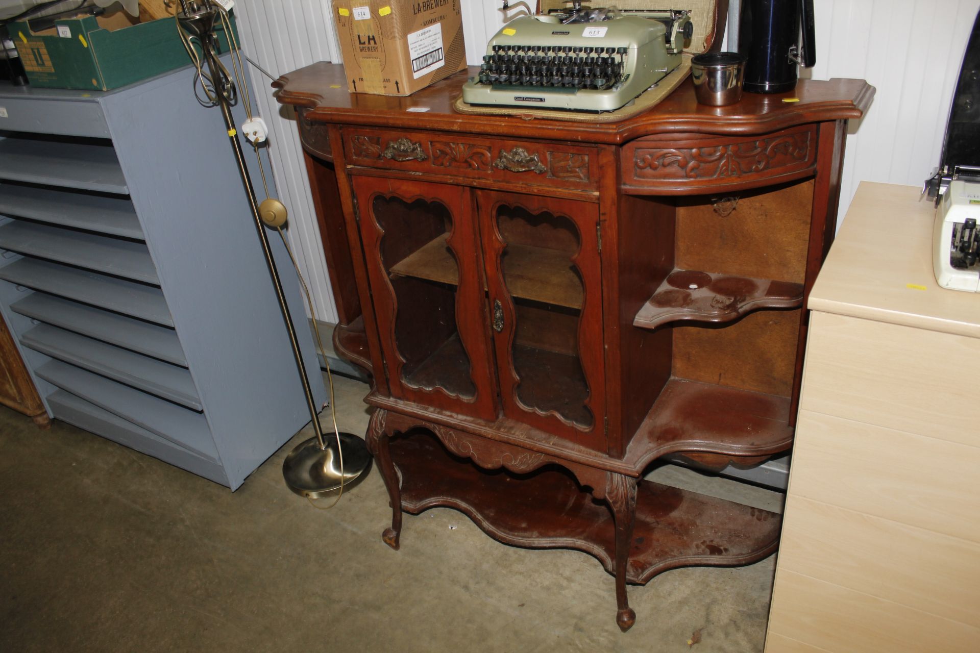 A Victorian serpentine mahogany china cabinet lack