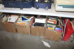 Four boxes and a case containing various books, CD