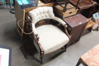 An Edwardian button back upholstered tub chair