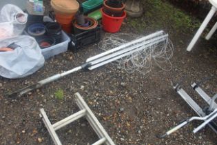 A rotary garden clothes airer and ground stake