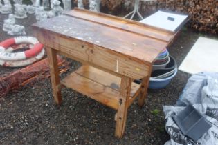 A small wooden workbench, fitted one drawer and sh