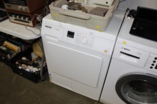 A Miele T Classic TDA150C tumble drier with instru