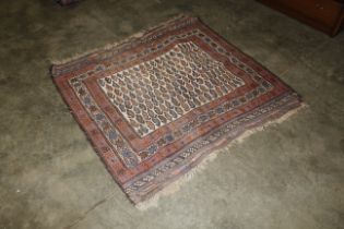 An approx. 4'5" x 4'7" red and blue patterned east