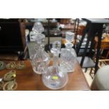 Three glass decanters and stoppers