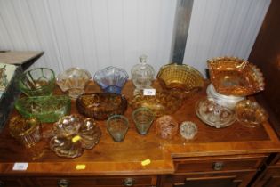 A quantity of various coloured glass fruit bowls e