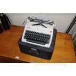 An Olympia typewriter in case