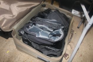 A Skyflight travel case and various holdalls, bags