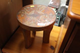 A small inlaid African three legged stool with