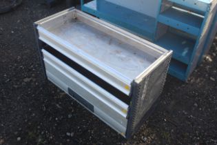 A metal van rack comprising three drawers to suit