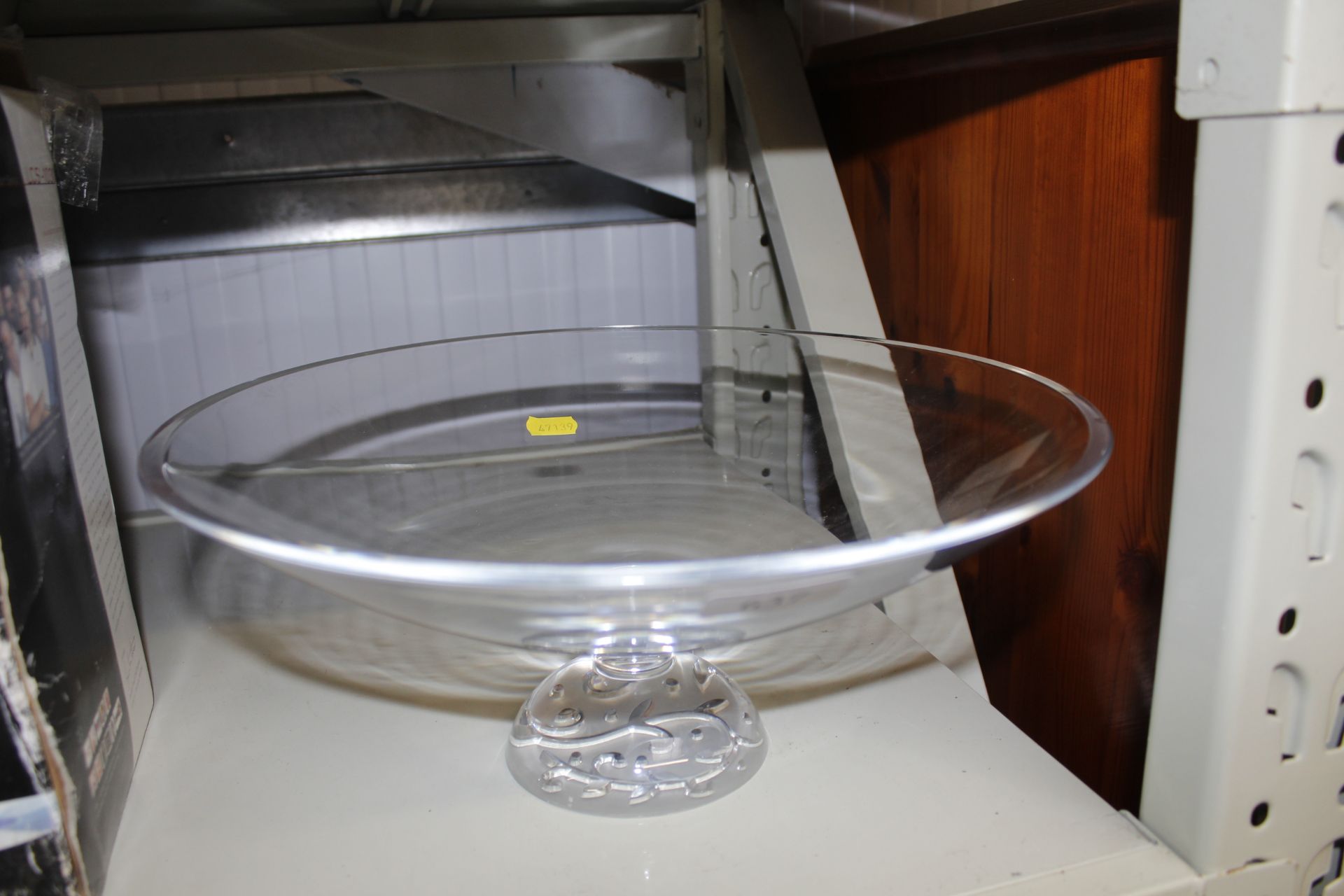 A glass fruit bowl on pedestal base