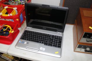 A Toshiba Satellite L500-1XD laptop with charger (