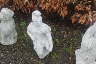 A cast concrete garden statue in the form of a Rom