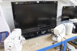 An LG 37LC55-ZA 37" television with remote control