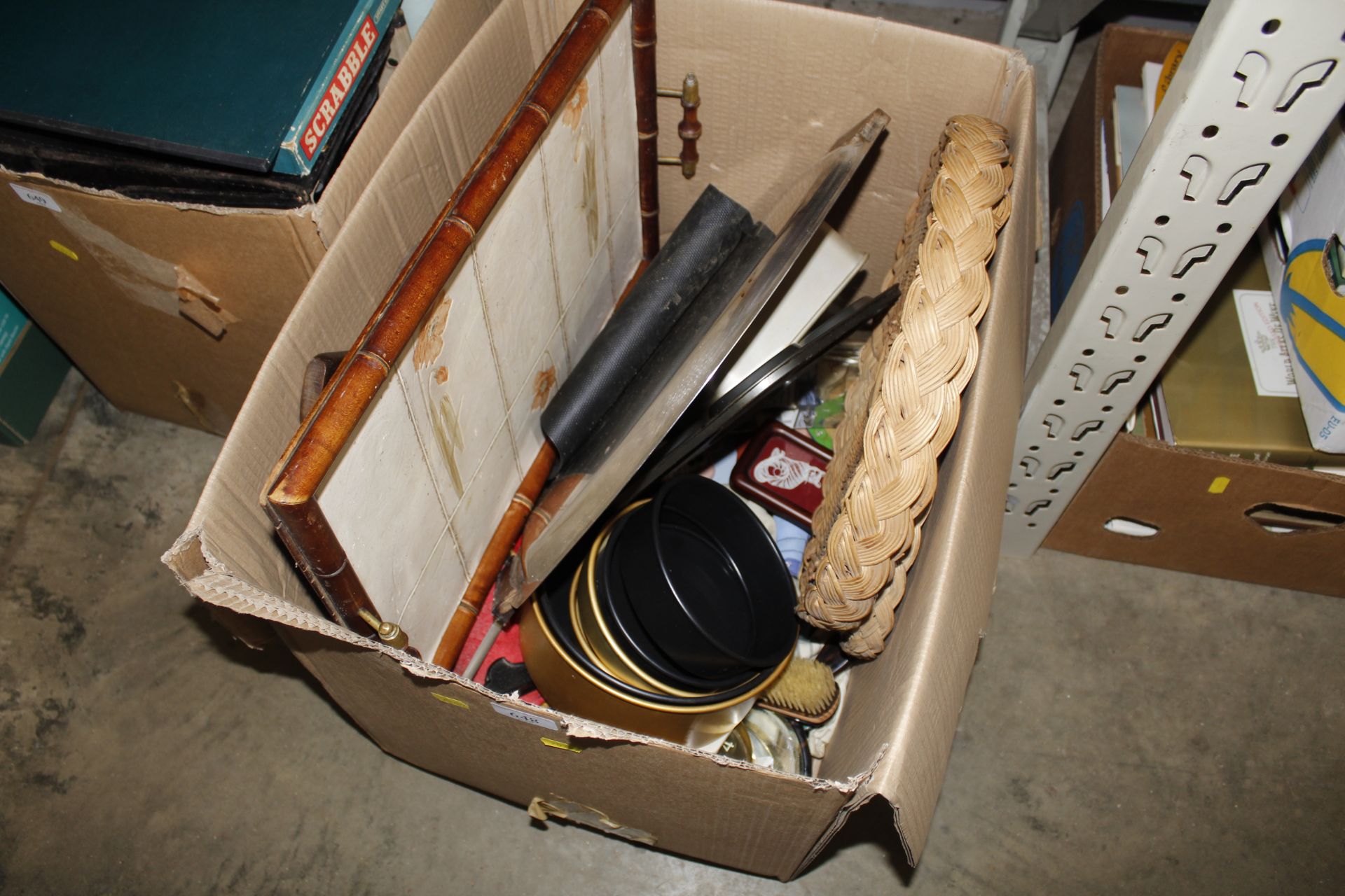 A box containing various items to include tile top