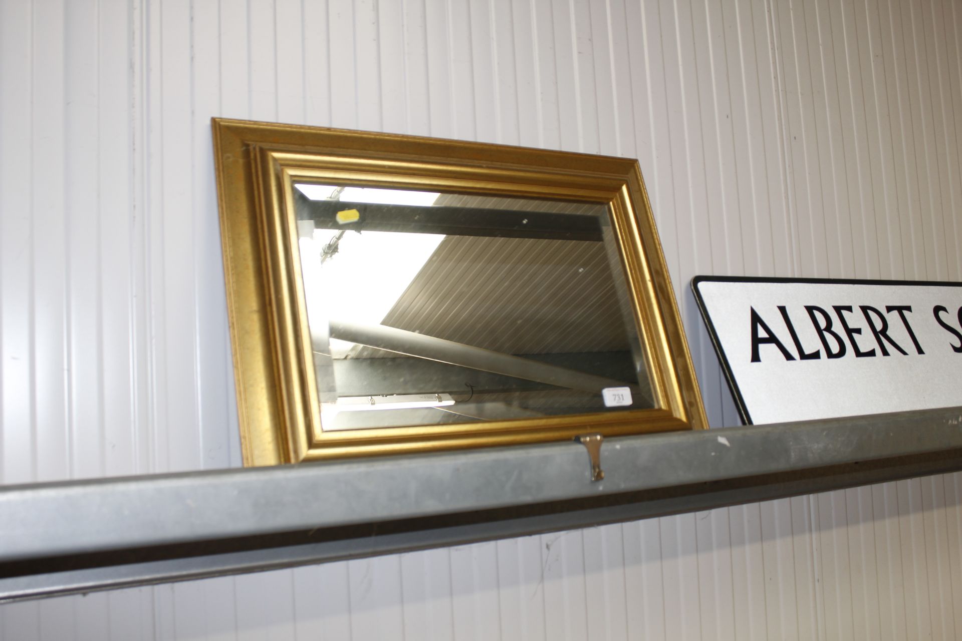 A gilt framed and bevelled edged wall mirror