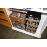 A quantity of various CD's, CD rack, wicker basket