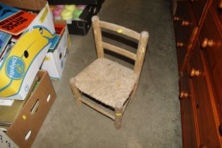 A small pine and string seated child's chair AF
