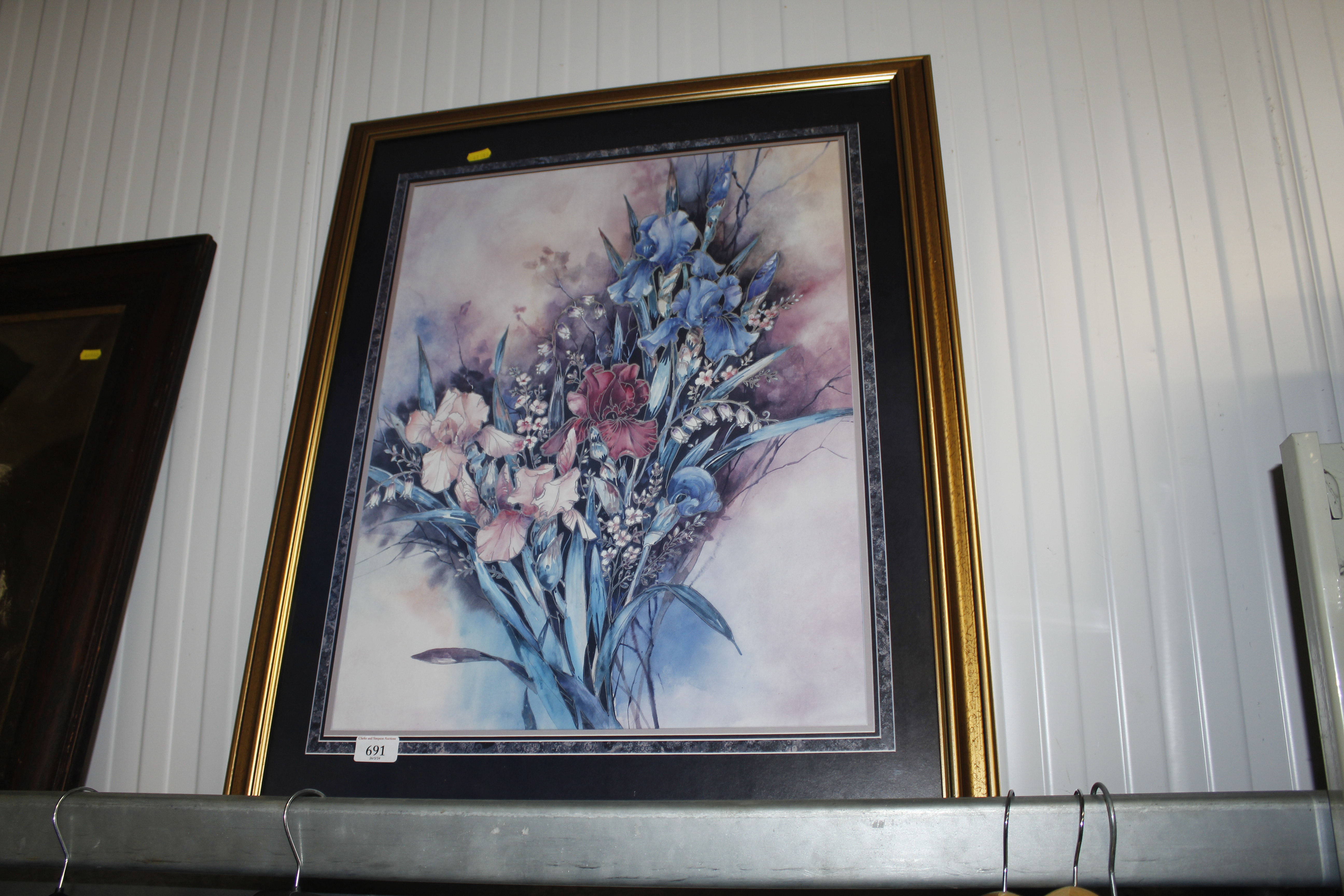 A gilt framed floral print