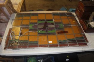 A coloured glass and leaded window panel AF