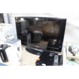 A Samsung LE32A457C1D 32" television with remote c