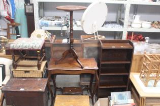 A mahogany shaped top window table and a circular