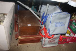A vintage suitcase; a wooden box and two sports ho