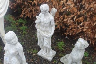 A large cast concrete garden statue in the form of
