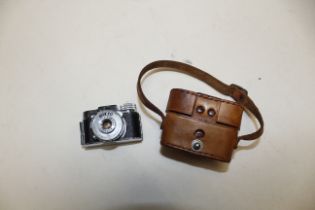 A miniature Mycro IIIA camera with carry bag