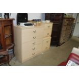 A modern chest of five drawers and a matching pair