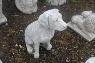 A cast concrete garden statue in the form of a sea