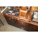 A small sideboard fitted two drawers over twin cup