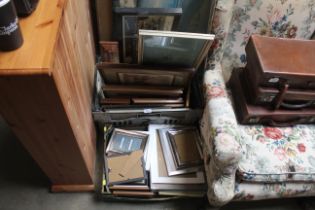 Two boxes containing various pictures and frames