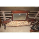 A wooden ornate tiled and mirrored washstand back