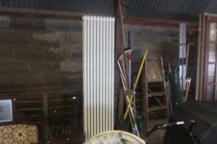 A tall radiator, measuring approx. 18" wide x 72"
