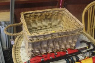 A wicker basket with twin rope handles