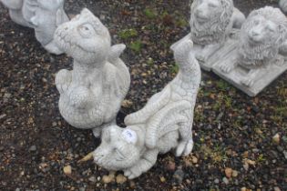 Two cast concrete garden statues in the form of ca