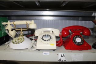 Three various rotary style telephones