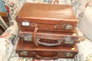 Three vintage leather cases