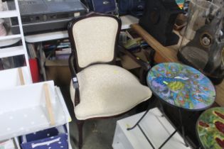 An upholstered elbow chair