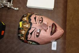 A Japanese carved wooden mask