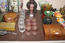 An Art Pink glass decanter and six goblets and a s