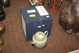A small Chinese celadon glazed bachelors teapot in