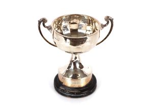 A silver trophy cup having half fluted body and sc